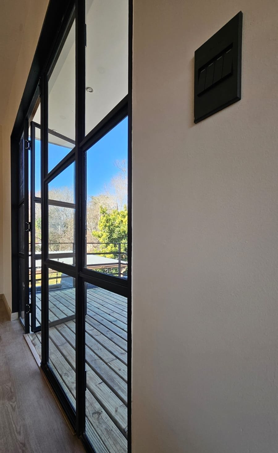 2 Bedroom Pod floor-to-ceiling glazing opening onto the deck