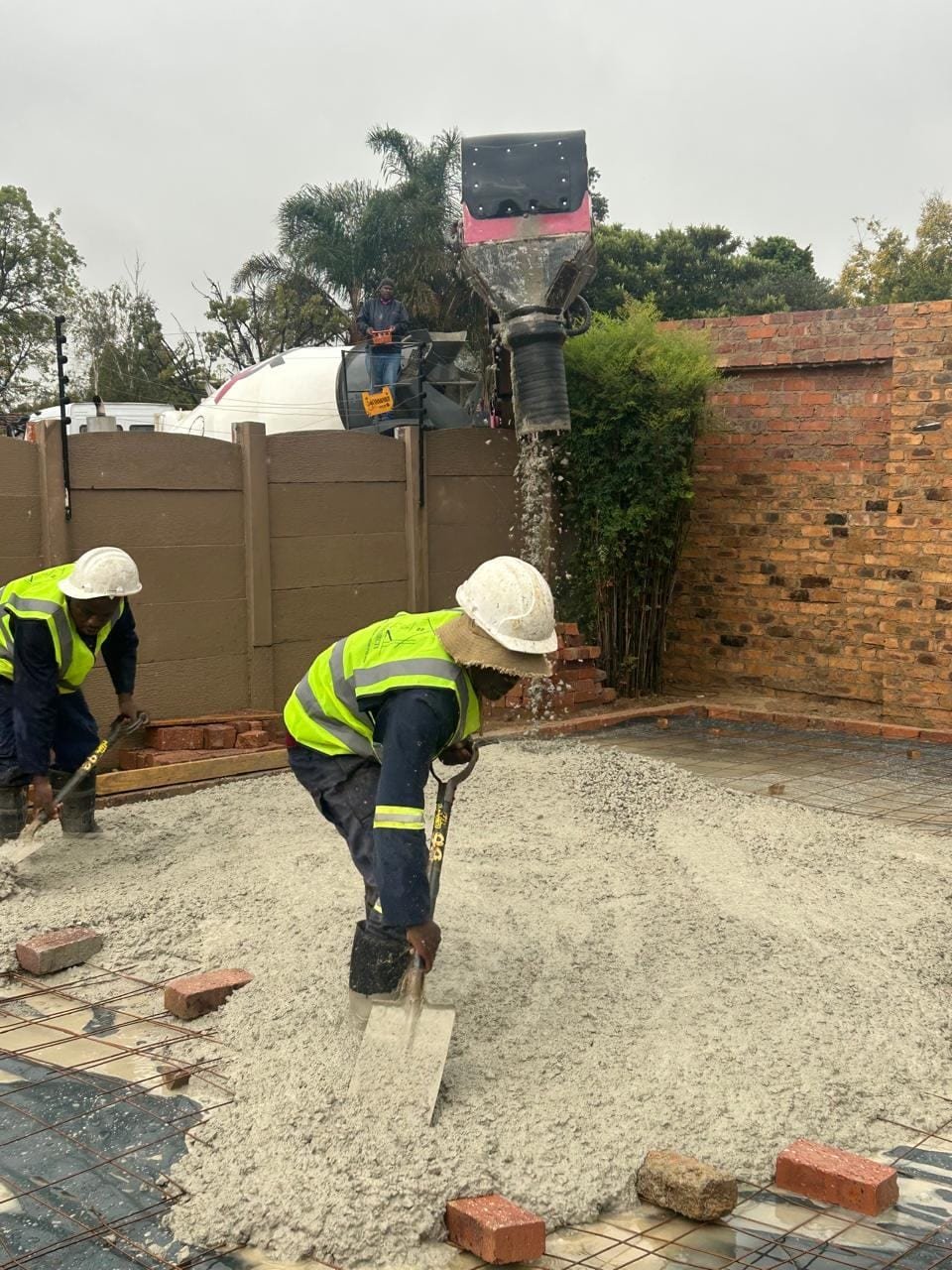Concrete slab being poured for the entertainment area foundation, Farrarmere