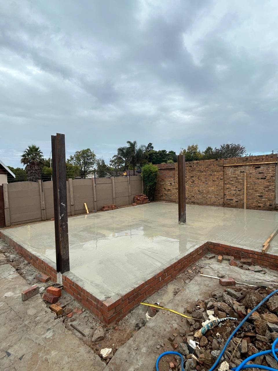 Completed concrete foundation with structural steel columns set, Farrarmere
