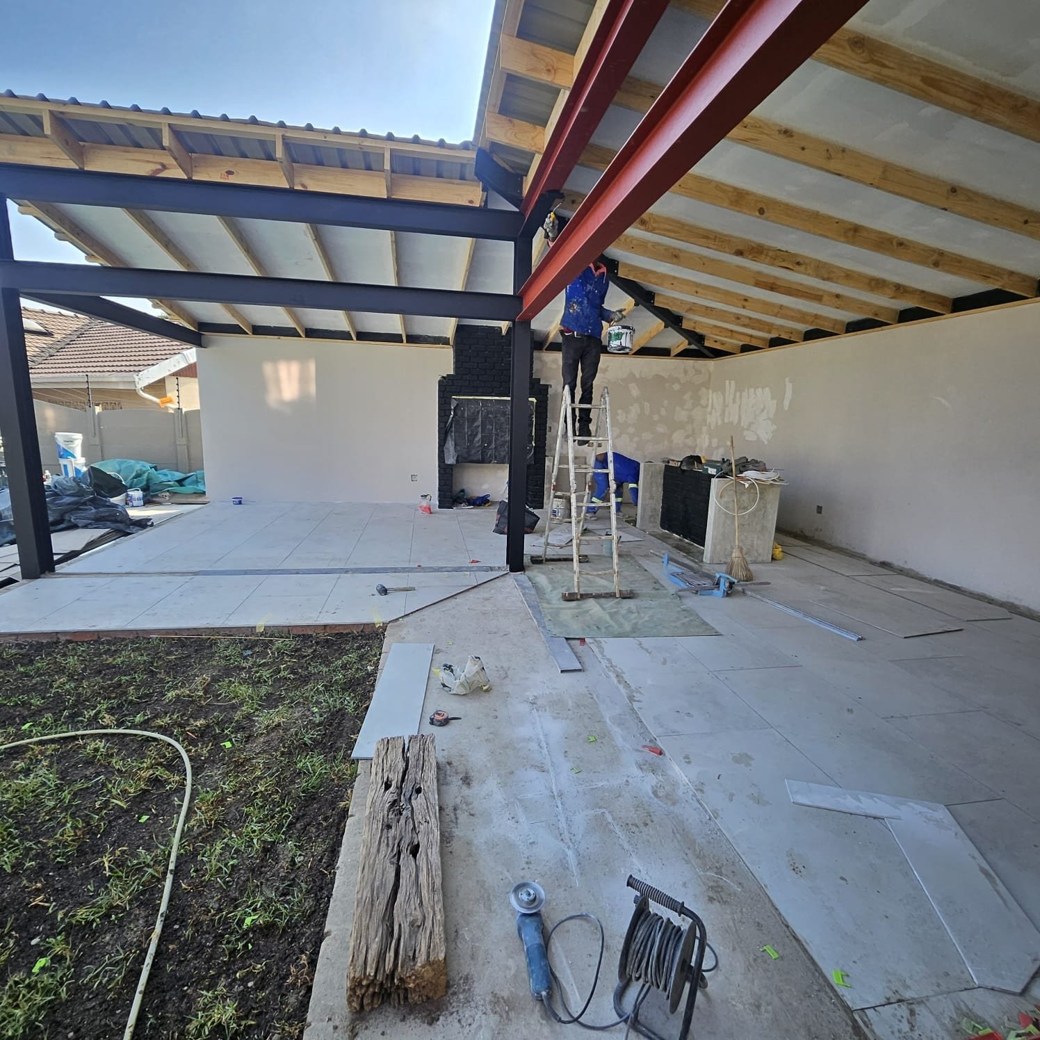Steel roof frame and brick braai under construction, Farrarmere