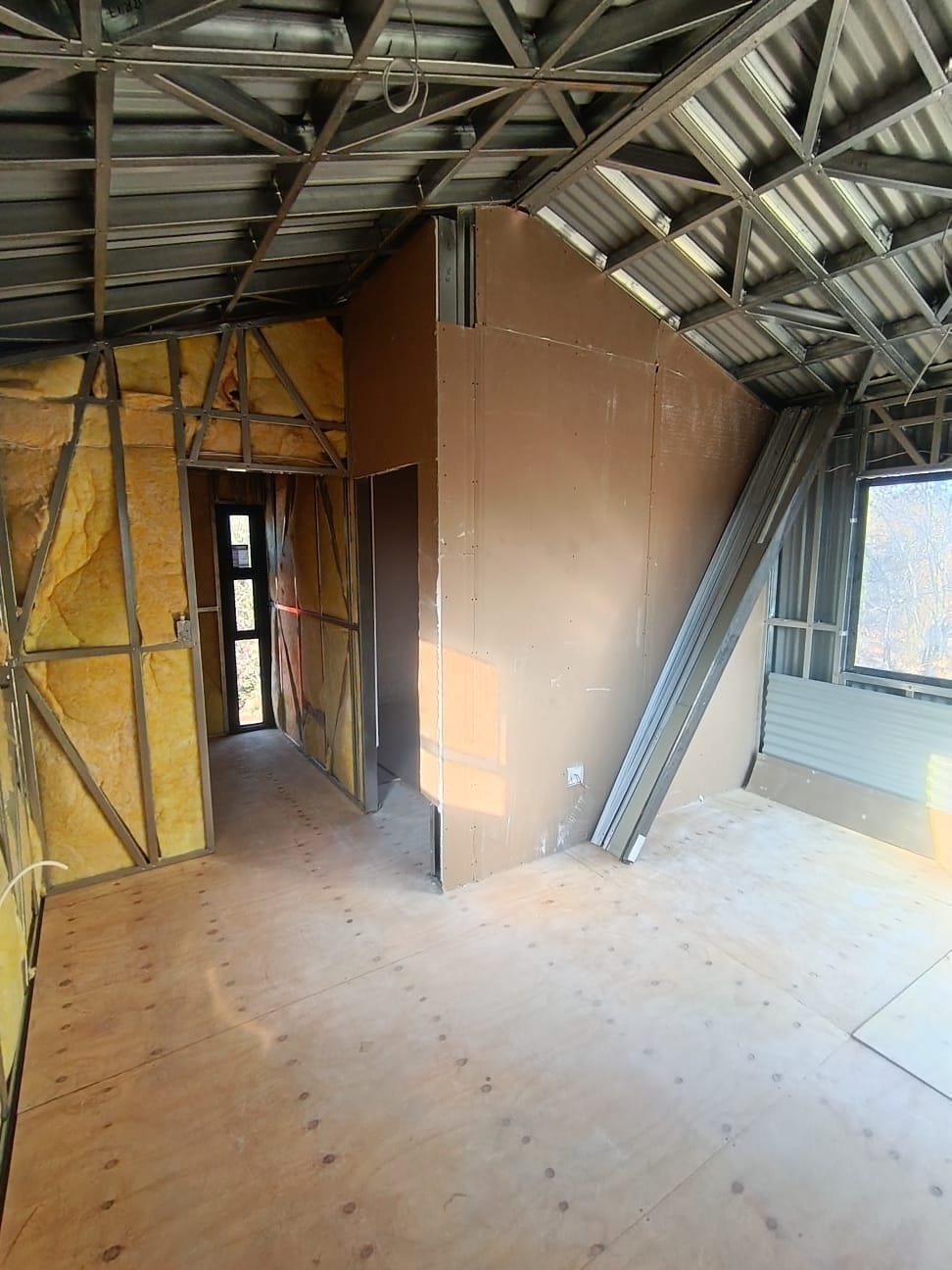 Tiny home interior insulation and drywall fit-out, steel frame structure, South Africa